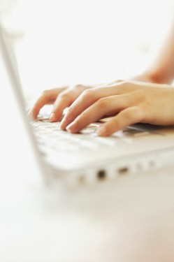Hands of Woman Using Laptop Computer